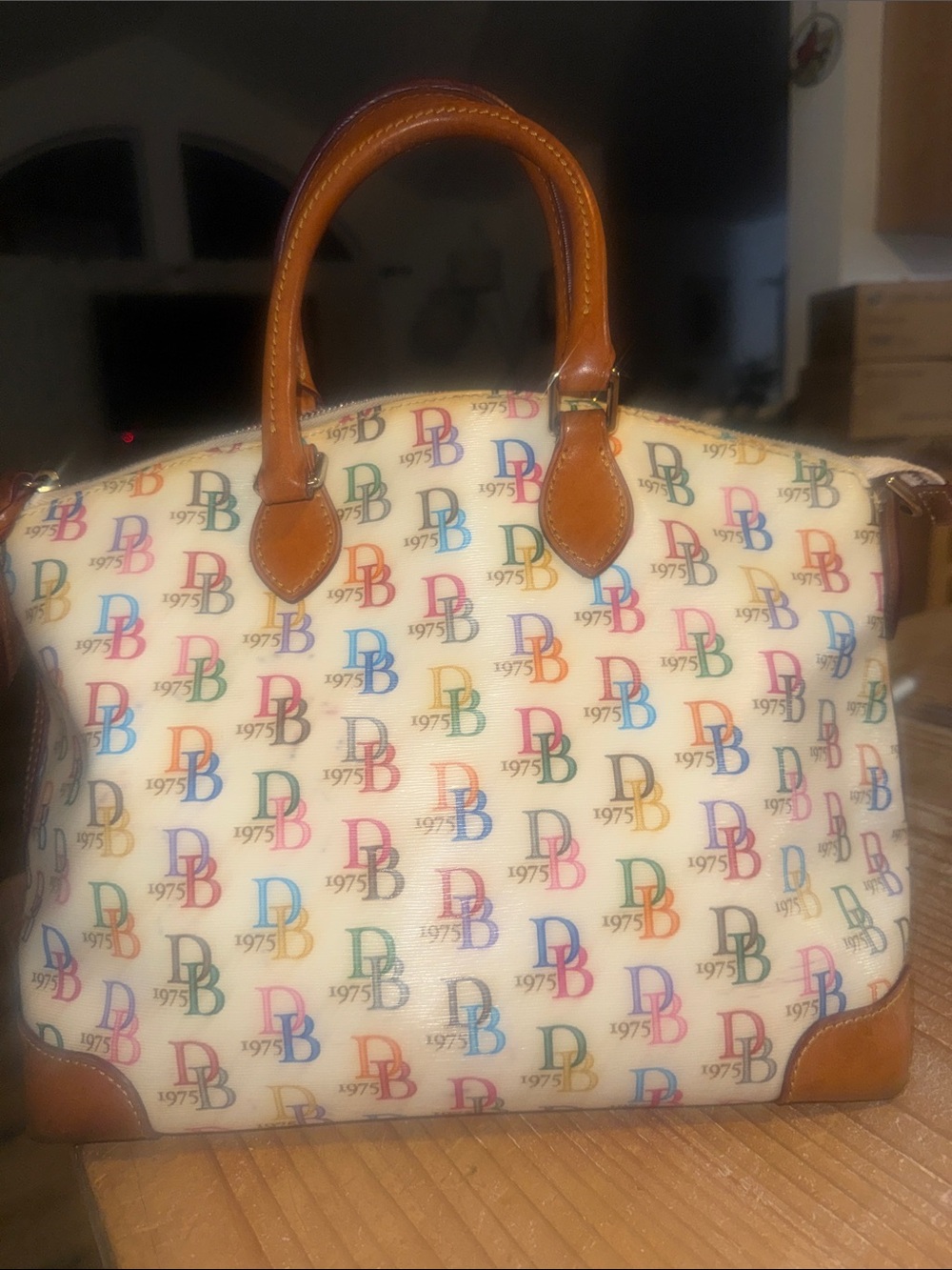 Dooney & Bourke satchel featuring a colorful "DB" monogram